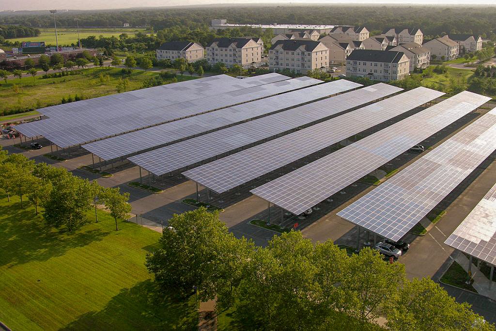 Large solar carport installation on parking lot of a large apartment complex